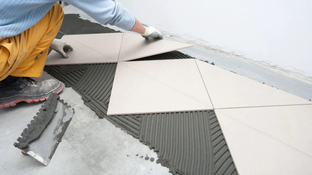 Large format porcelain tile installation in progress in a Bellevue, WA bathroom by Custom Touch Interiors